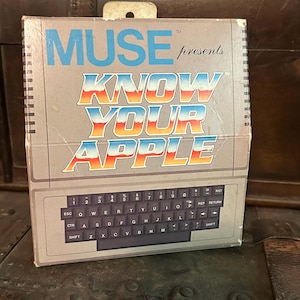 May include: A vintage box for a computer game called "Know Your Apple" by Muse. The box features a retro-style keyboard and the title in bold, colorful letters.