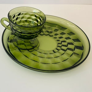 May include: A green glass serving dish with a matching green glass cup. The dish and cup have a diamond pattern.
