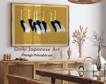 May include: A vintage Japanese art print featuring a group of seven white and black cranes on a yellow background. The print is framed in a light wood frame and is titled "Daiki Japanese Art Vintage Printable Art".