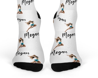 May include: White socks with a repeating pattern of a woman in a blue skirt and the name "Megan" written in black.