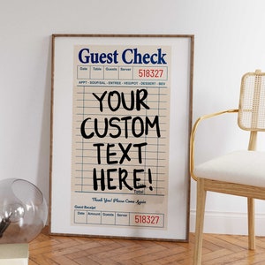 Custom text guest check print framed on floor. Personalized retro diner poster for trendy dorm decor. Beige aesthetic wall art.