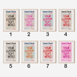 May include: Eight framed prints of "Guest Check" designs. Each print features the text "YOUR CUSTOM TEXT HERE!" in various colors, including black, pink, red, and orange, on a grid background. The prints are in wooden frames.