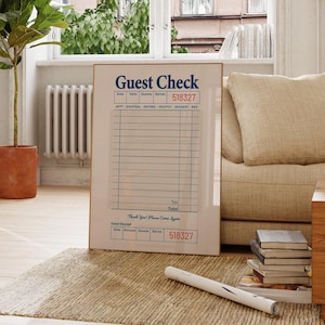 May include: A framed print of a vintage-style guest check with the text "Guest Check" and the number "518327" printed in red. The check has lines for writing down orders and a section for a guest receipt.