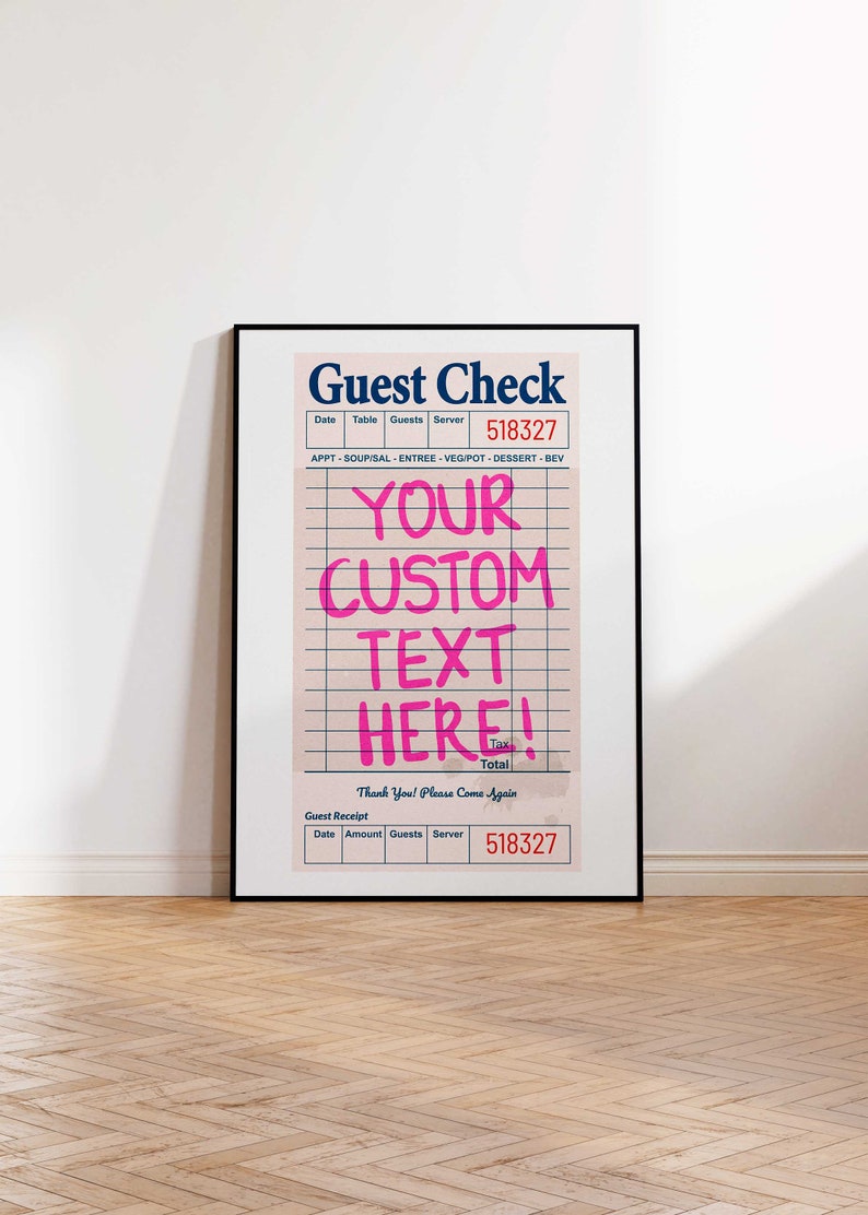 May include: Framed print of a guest check with the words "Guest Check" at the top. The check has a pink background with grid lines and the text "YOUR CUSTOM TEXT HERE!" in bright pink. The print is in a black frame.