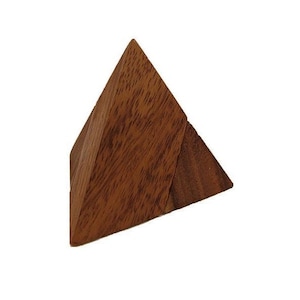 May include: A wooden pyramid puzzle with a rich brown color. The puzzle is made of two interlocking triangular pieces. The wood grain is visible on the surface of the puzzle.
