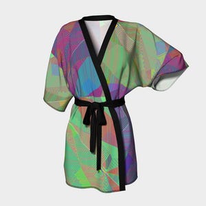 May include: A short kimono-style robe featuring a vibrant, multi-colored geometric pattern with shades of green, purple, and blue. The garment has a solid black trim along the collar and front opening, and includes a matching black fabric tie belt.