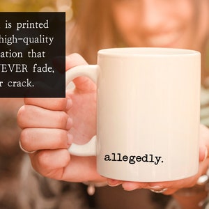 May include: White ceramic coffee mug with black text that reads "allegedly."