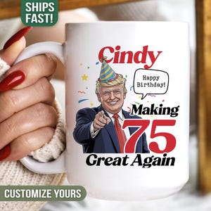 May include: White ceramic mug with a cartoon image of a man wearing a party hat, with the text "Cindy Happy Birthday! Making 75 Great Again". The mug has a white handle.