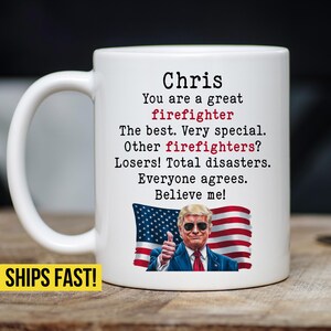 May include: White ceramic coffee mug with a red, white and blue American flag design. The mug has the text "Chris You are a great firefighter The best. Very special. Other firefighters? Losers! Total disasters. Everyone agrees. Believe me!" printed on it.