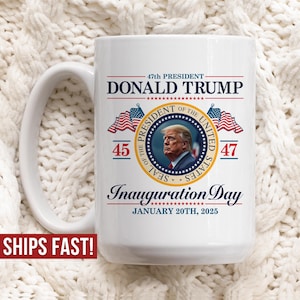 May include: White ceramic coffee mug with a red, white, and blue design featuring a portrait of Donald Trump, the text "47th President Donald Trump", and the text "Inauguration Day January 20th, 2025".