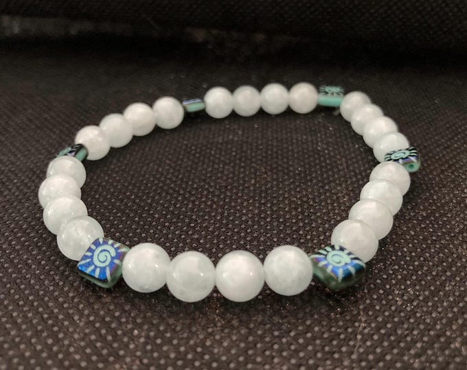 Sunlit Calm Bracelet - Aquamarine Beaded Bracelet on Elastic Cord with Czech Glass Laser Etched Sun on Turquoise with Iris Blue Finish