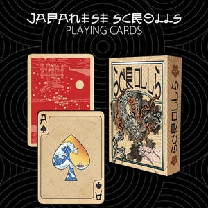 May include: A deck of Japanese Scrolls playing cards featuring a box with a dragon illustration and the text SCROLLS. Two cards are displayed: one with a red landscape design and one with a spade symbol containing a wave and mountain graphic.