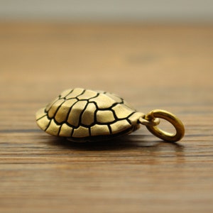 New creative pendant, turtle shell rich Jiatian oracle bone inscription ornaments, keychain pendant brass retro old