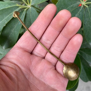 Antique and retro copper cast water spoon