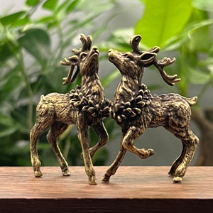 Two brass sika deer statues, creative brass ornaments on the desktop, small bronze elk