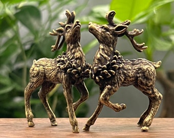 Two brass sika deer statues, creative brass ornaments on the desktop, small bronze elk