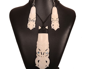 Tiki design bound bone toki pendant necklace and earring set.