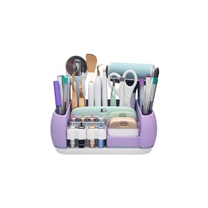 May include: A lilac craft organiser filled with various tools, including scissors, pens, and blades. The organiser has multiple compartments and a white base. A light blue roller and gold-coloured tools are also visible.