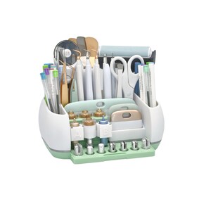 May include: A white and mint green craft tool organizer filled with various tools. The organizer has compartments for pens, tweezers, scissors, and other crafting essentials. The tools are in shades of white, gold, and mint green.