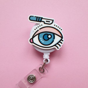 Badgehaspel ooglidcorrectie, kaarthouder esthetische chirurgie, cadeau plastisch chirurg, badgeclip ooglid, sleutelkoord cosmetica, clip medische identiteitskaart