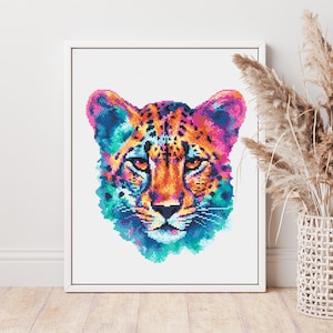 May include: A colourful abstract painting of a cheetah's face. The cheetah's fur is a mix of orange, yellow, pink, blue and green. The background is white.