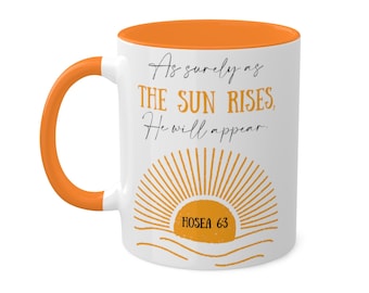 May include: White ceramic mug with an orange rim and handle. The mug features a graphic of a sunrise with the text "As surely as THE SUN RISES, He will appear." and "HOSEA 6:3".