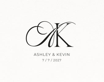May include: A black graphic design featuring a large, stylised, calligraphic monogram of the letters A and K. Below the monogram, the text reads ASHLEY & KEVIN in a simple sans-serif font, followed by the date 7 / 7 / 2027 on the next line.