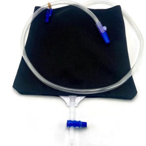 May include: A black medical bag with a clear plastic tube and blue connectors. The tube is looped around the bag, and a small rubber band secures one end. The bag has a white valve at the bottom.