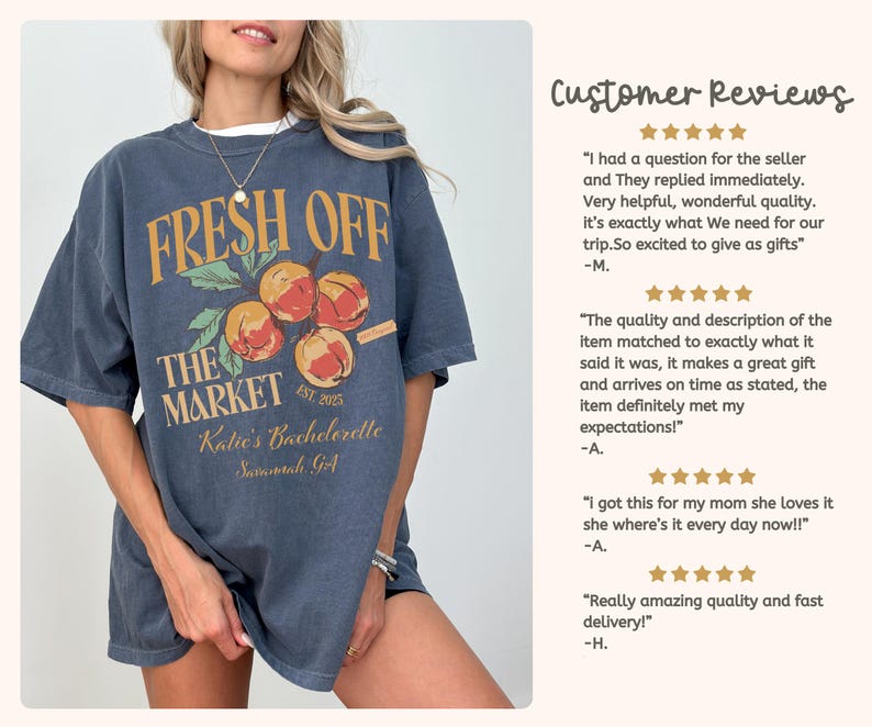 May include: A dark blue t-shirt with a graphic design featuring the text "FRESH OFF THE MARKET" above a cluster of peaches. The text "Katie's Bachelorette Savannah GA" is below the peaches.