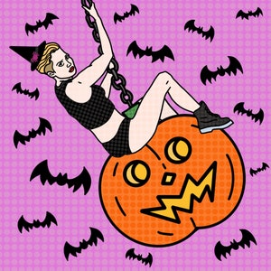 May include: A woman dressed as a witch is swinging from a chain attached to a large orange pumpkin with a scary face. The background is a pink and white polka dot pattern with bats flying around.