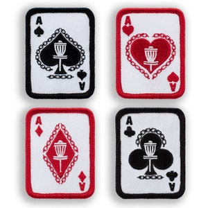 May include: Four square patches featuring the Ace of each suit from a deck of cards, with a disc golf basket design in the center. The patches have a white background, with black or red borders and suit symbols. The disc golf basket is black or red.