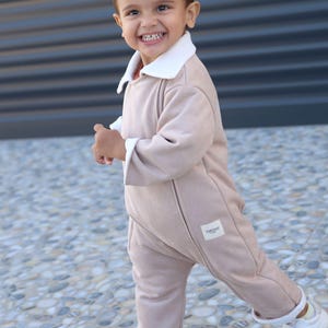 Scuba Suede Front Zippered Romper Latte – The Ultimate Winter Protection for Your Baby