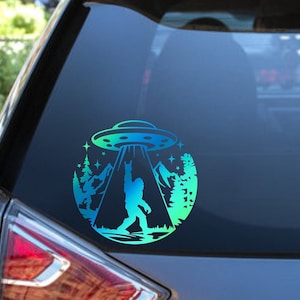 Bigfoot UFO Abduction Vinyl Decal | Holographic Bumper Sticker | Funny Sasquatch Laptop Sticker | Alien Humor | Unique Outdoor Decal