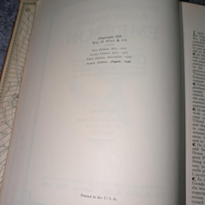 May include: Open book with text: "Copyright 1929 WM. H. Wise & Co." and edition dates from May 1929 to August 1930. The text "Printed in the U.S.A." is also visible. The book's pages are off-white.