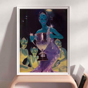 May include: A group of four blue-skinned women in silver and purple costumes stand in a dark room with a spotlight shining on them. The woman in the center holds a silver trophy. The women are wearing silver headbands and have large, expressive eyes.
