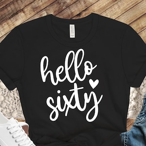 May include: Black t-shirt with white text that says "hello sixty" with a small heart.