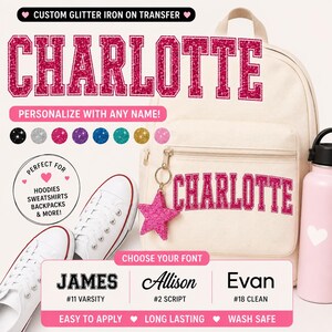 May include: A cream-colored backpack with the name "CHARLOTTE" in pink glitter lettering. The image also shows a pair of white sneakers, a pink water bottle, and a pink star-shaped keychain. Text reads "CUSTOM GLITTER IRON ON TRANSFER" and "PERSONALIZE WITH ANY NAME!"