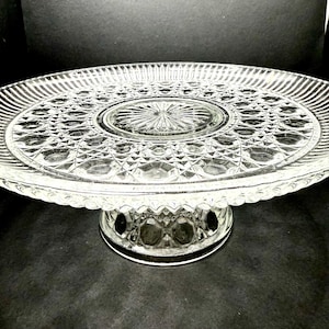 May include: A set of three ceramic mugs with a speckled, matte finish. Each mug features a different color: light blue, cream, and gray. The mugs have a simple, modern design and a comfortable handle.