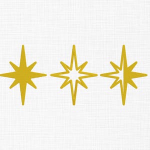 May include: Three yellow starburst designs on a white background. Each star has a different style, with solid and open designs. The stars are evenly spaced and create a decorative pattern.