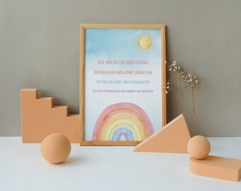 May include: A framed print with a watercolor rainbow and a sun. The print has text in German that reads: "ICH BIN MUTIG UND STARK, ICH BIN KLUG UND LERNE JEDEN TAG, ICH BIN GELIEBT UND EINZIGARTIG, ICH BIN FREUNDLICH UND IMMER HILFSBEREIT."