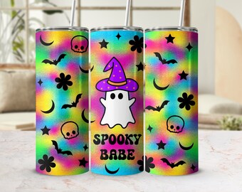 May include: Three stainless steel tumblers with a rainbow tie-dye pattern and black accents. The center tumbler features a ghost wearing a purple and black witch hat and the text "Spooky Babe".
