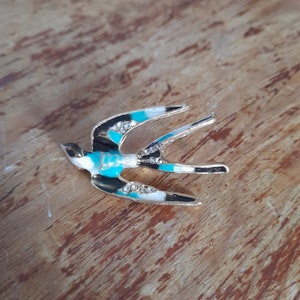 Vintage enamel and metal swallow brooch