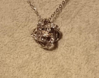 Vintage silver tone and rhinestone love knot pendant necklace