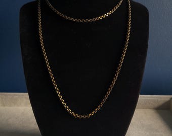 Vintage Avon gold and black tone long chain necklace