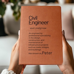 May include: A brown notebook with the words "Civil Engineer" printed on the cover. The text includes a phonetic pronunciation and a definition of the profession, mentioning infrastructure projects. The name "Peter" is also printed on the cover.