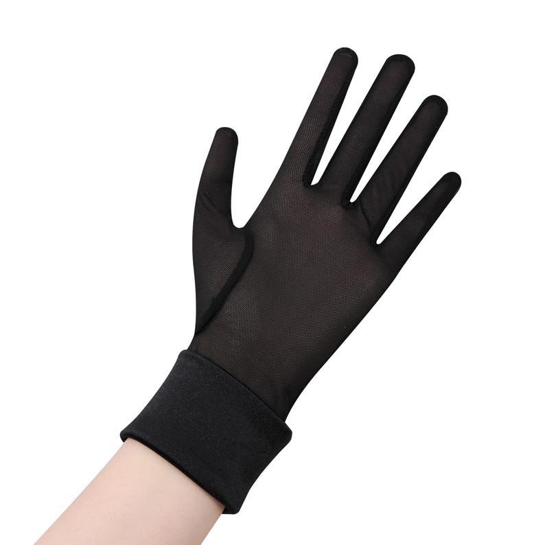 May include: Black sheer glove with a close-fitting cuff. The glove is made of a lightweight, breathable material. The fingers are fully covered, and the glove extends to the wrist.