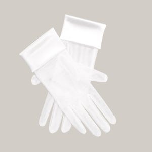 May include: A pair of white gloves with a satin cuff. The gloves are made of a sheer material, and the cuffs are folded over. The gloves are lying on a neutral background.