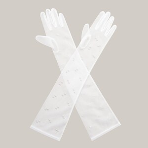 May include: A pair of long white gloves with a delicate pearl pattern. The gloves are made of a sheer fabric and are perfect for a special occasion.