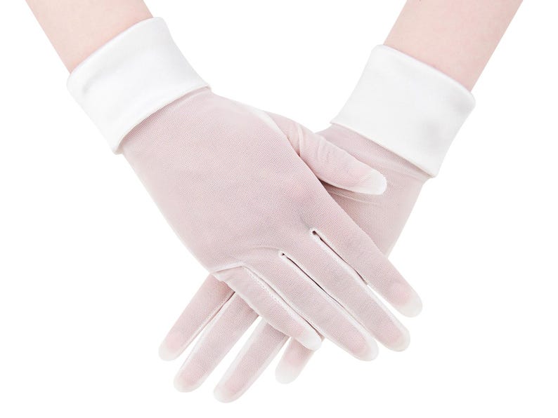 May include: A pair of sheer, pale pink gloves with white cuffs. The gloves are made of a delicate, semi-transparent fabric, and the fingers are slightly curved. The white cuffs provide a contrasting accent to the gloves.