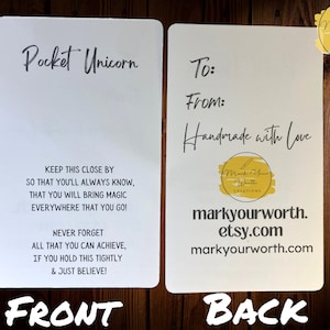 May include: White card with the text "Pocket Unicorn" and a poem about bringing magic. The back of the card has the text "To:" and "From:" and the words "Handmade with love". The card also has the text "markyourworth.etsy.com" and "markyourworth.com".